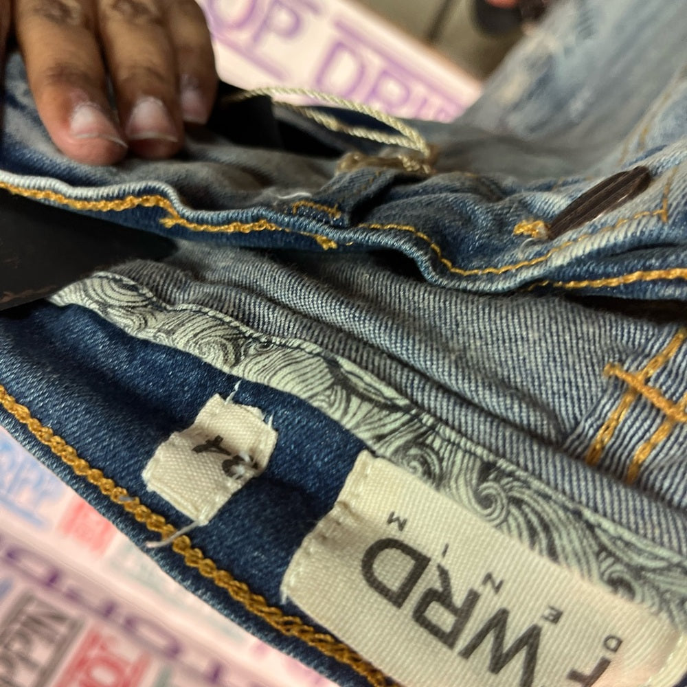 Sz Various evolution graphic ripped denim jeans