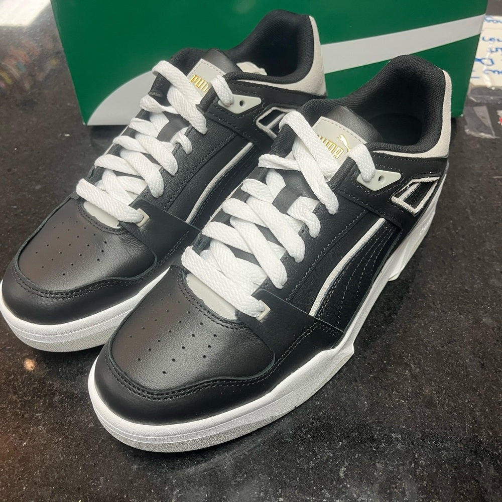 Puma lows Sz Various white & black