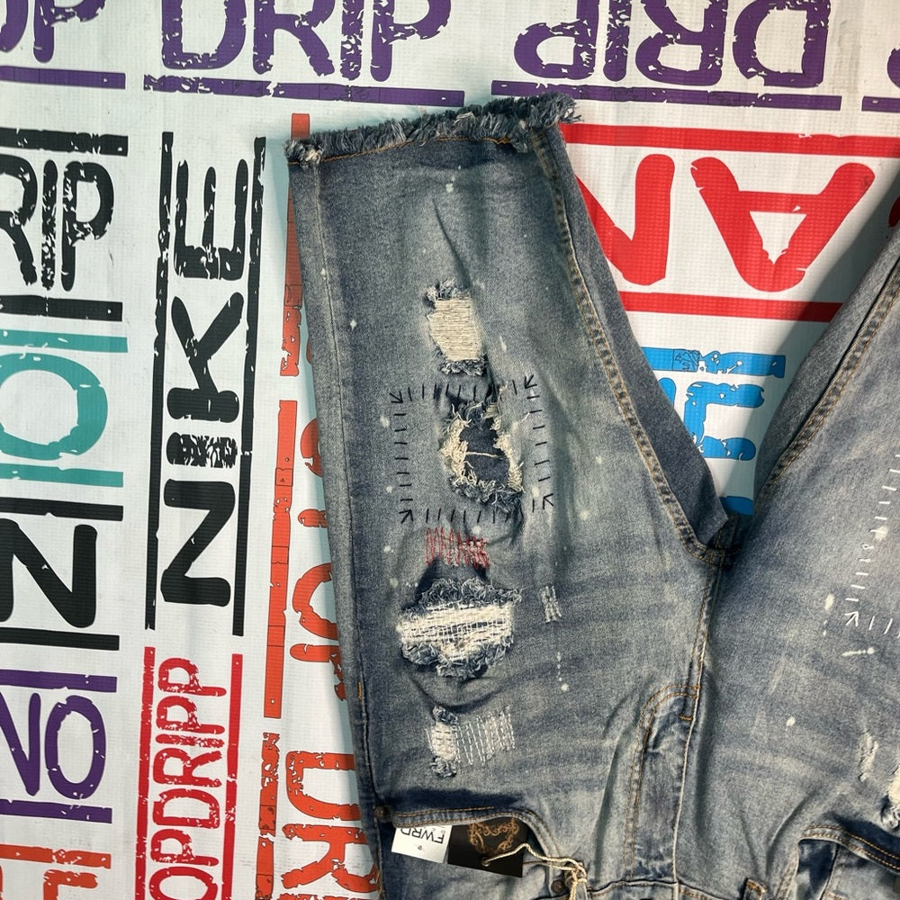 Sz Various evolution graphic ripped denim jeans