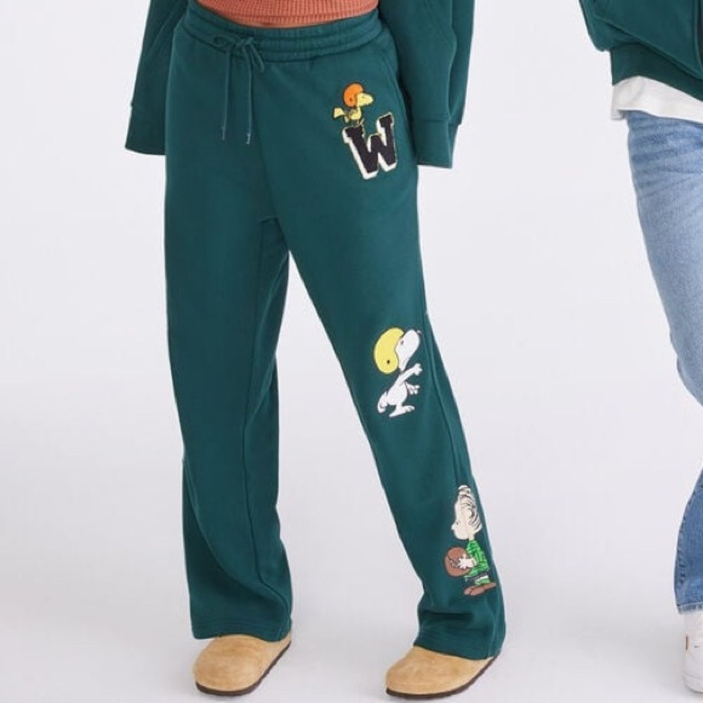 Comfortable and stylish teal sweatpants featuring fun cartoon!