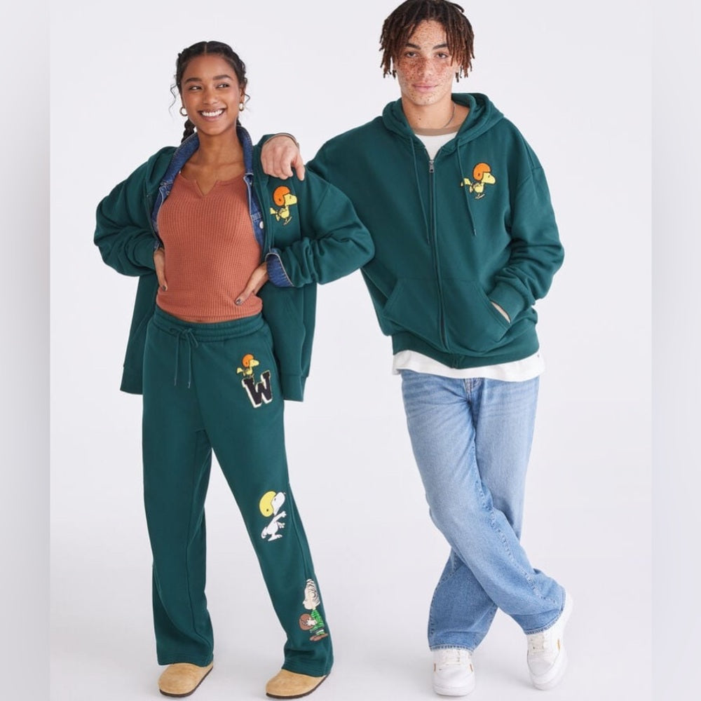 Comfortable and stylish teal sweatpants featuring fun cartoon!